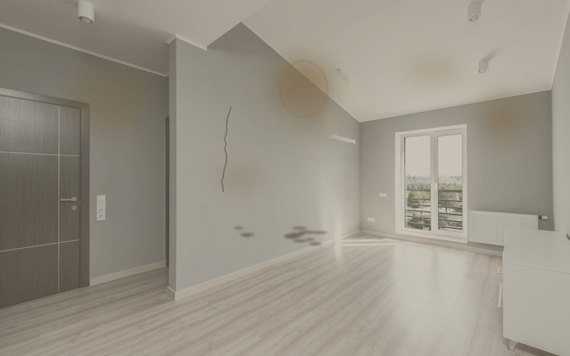 Room before painting: yellowed, stained walls